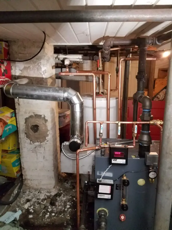 Boiler and piping installation in a basement